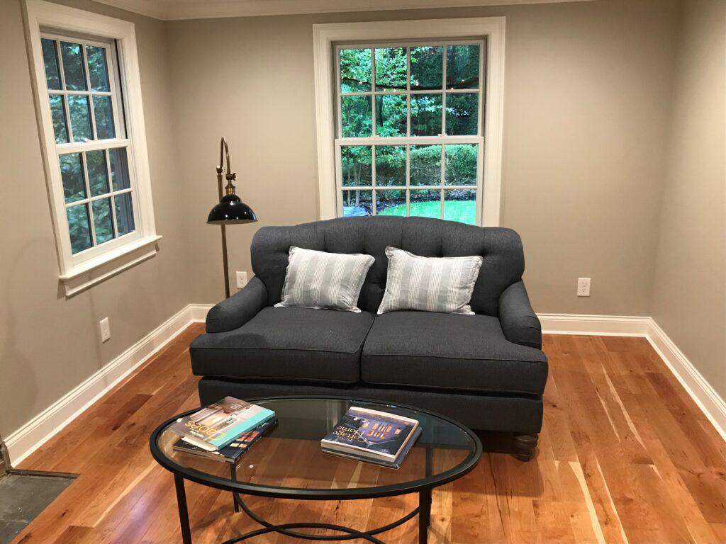 Cherry Hardwood Flooring room scene with couch - Character grade prefinished natural flooring