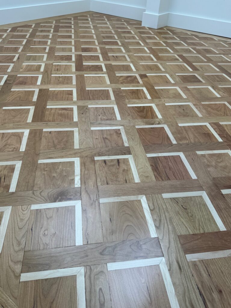 Cherry hardwood flooring with Maple Flank design