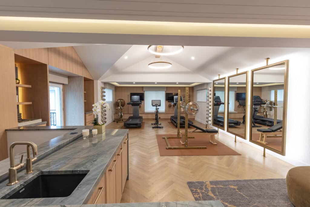 Exercise home gym with beautiful herringbone pattern White Oak hardwood flooring