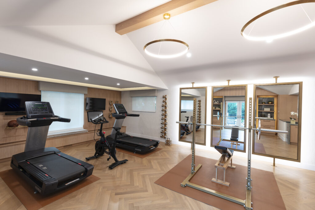 Exercise home gym with beautiful herringbone pattern White Oak hardwood flooring