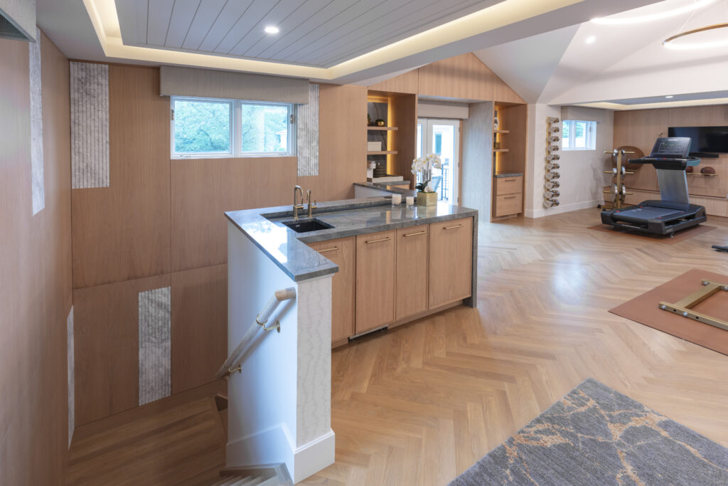Exercise home gym with beautiful herringbone pattern White Oak hardwood flooring